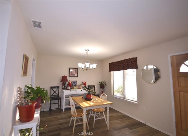 27958 Foxfire St, Menifee, CA 92586 - dining room with healthy amount of natural light, a chandelier, and dark wood-type flooring