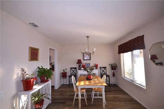 27958 Foxfire St, Menifee, CA 92586 - dining room with a chandelier and dark wood finished floors