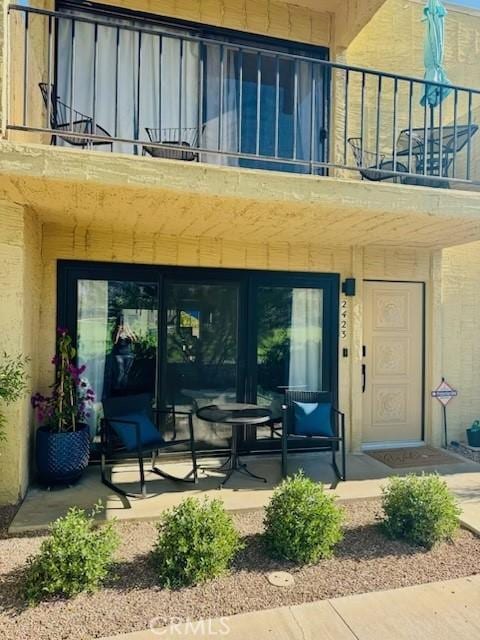 2423 Los, Patos, Palm Springs, CA 92264 - property entrance featuring a balcony and french doors