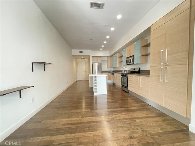 1234 Wilshire Blvd Unit 127, Los Angeles, CA 90017 - kitchen featuring appliances with stainless steel finishes, open shelves, dark wood-type flooring, modern cabinets, and recessed lighting