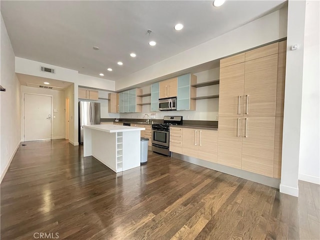 1234 Wilshire Blvd Unit 127, Los Angeles, CA 90017 - kitchen featuring stainless steel appliances, open shelves, a kitchen island, dark wood finished floors, and recessed lighting