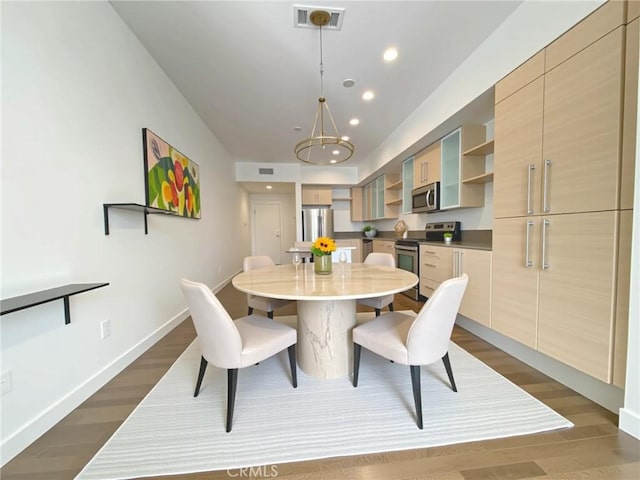 1234 Wilshire Blvd Unit 127, Los Angeles, CA 90017 - dining area featuring dark wood-style flooring, recessed lighting, and a chandelier