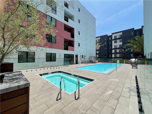 1234 Wilshire Blvd Unit 127, Los Angeles, CA 90017 - community pool featuring a patio