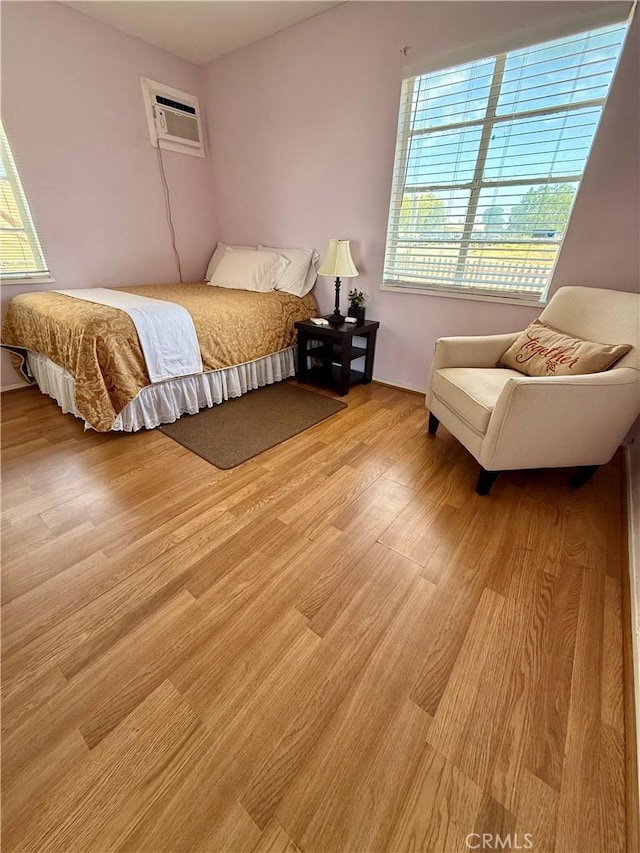 2616 N King St, Bakersfield, CA 93305 - bedroom featuring a wall unit AC and light wood finished floors