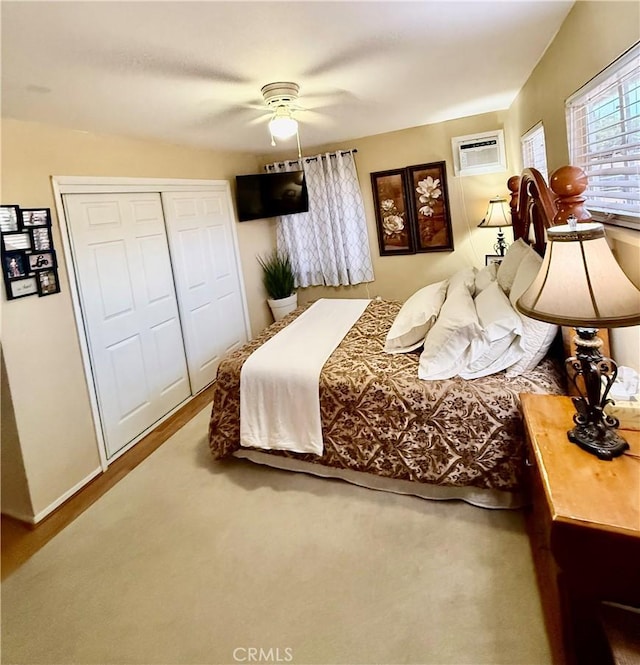 2616 N King St, Bakersfield, CA 93305 - bedroom featuring an AC wall unit, a closet, and a ceiling fan