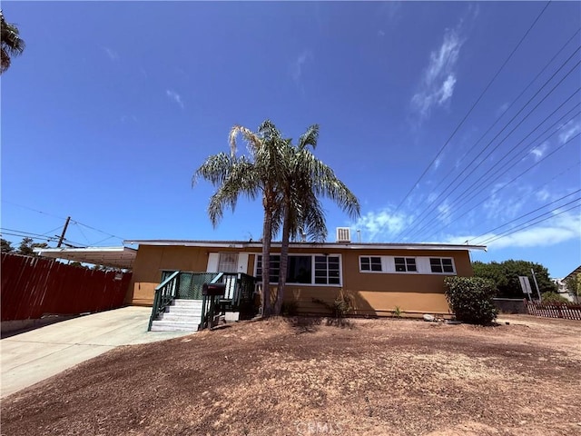 2616 N King St, Bakersfield, CA 93305 - manufactured / mobile home with driveway, an attached carport, and stucco siding