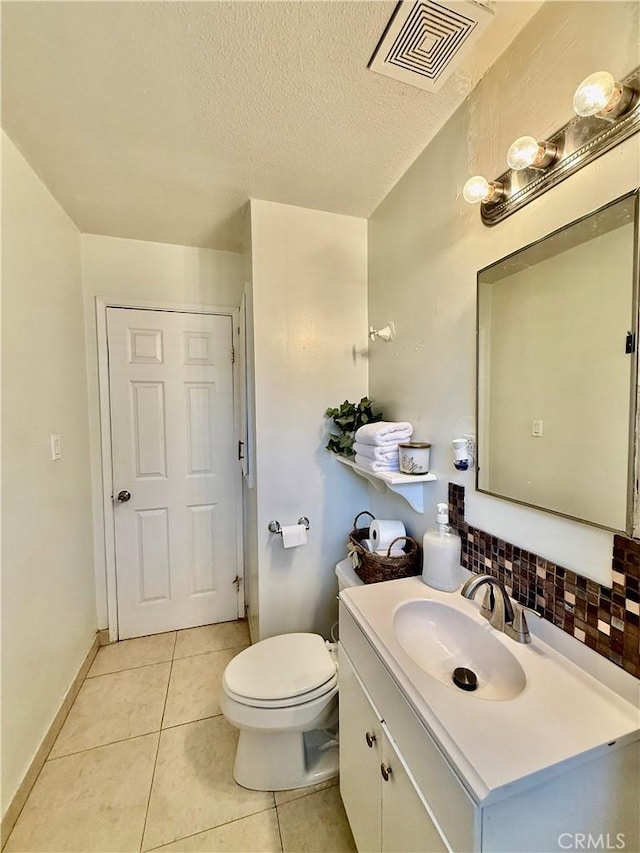 2616 N King St, Bakersfield, CA 93305 - bathroom with vanity, tile patterned flooring, and a textured ceiling
