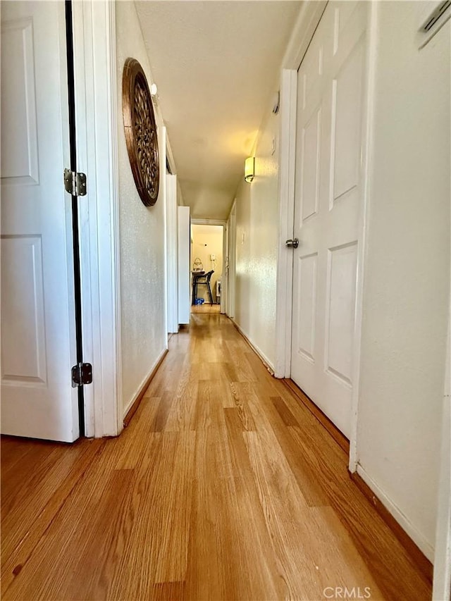 2616 N King St, Bakersfield, CA 93305 - hallway with light wood-type flooring and baseboards