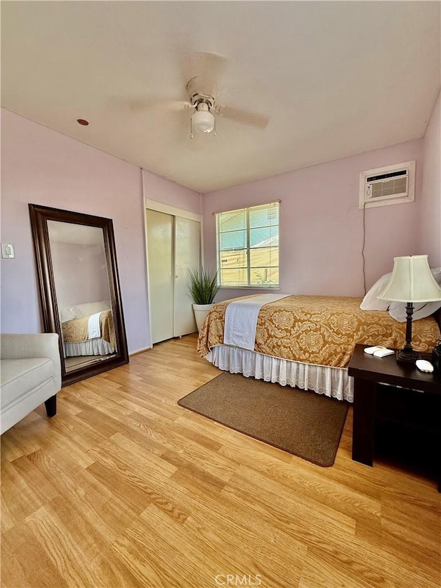2616 N King St, Bakersfield, CA 93305 - bedroom featuring light wood-style flooring, a wall unit AC, a ceiling fan, and a closet