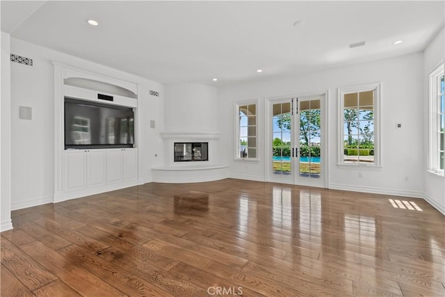 25471 Prado De Oro, Calabasas, CA 91302 - unfurnished living room featuring wood-type flooring, recessed lighting, and a glass covered fireplace