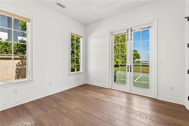 25471 Prado De Oro, Calabasas, CA 91302 - spare room featuring healthy amount of natural light, wood finished floors, and french doors