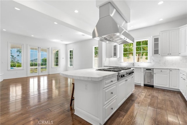 25471 Prado De Oro, Calabasas, CA 91302 - kitchen with island exhaust hood, stainless steel gas cooktop, a center island, dark wood-style flooring, and open floor plan