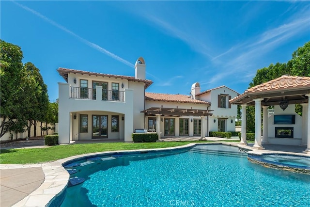 25471 Prado De Oro, Calabasas, CA 91302 - rear view of property featuring a balcony, a pool with connected hot tub, a patio area, a chimney, and a tile roof
