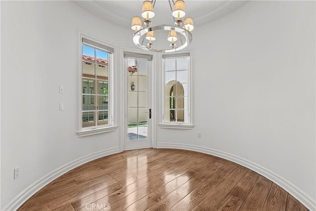 25471 Prado De Oro, Calabasas, CA 91302 - unfurnished dining area with a chandelier and wood finished floors