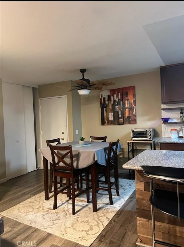 23515 Lyons Ave Unit 277, Valencia, CA 91355 - dining space featuring dark wood-style floors and ceiling fan