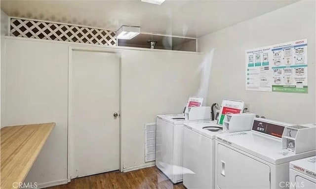 23515 Lyons Ave Unit 277, Valencia, CA 91355 - community laundry room featuring washer and dryer and dark wood-style flooring