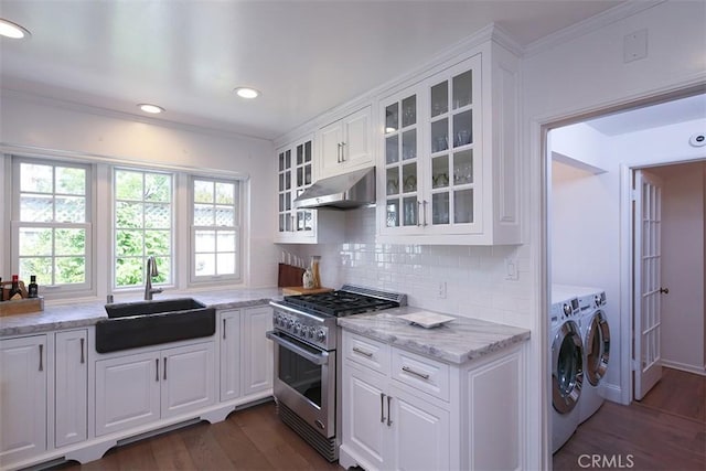2450 Hermosita Dr, Glendale, CA 91208 - kitchen featuring separate washer and dryer, stainless steel range, under cabinet range hood, dark wood-style floors, and white cabinetry