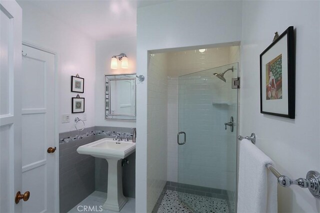 2450 Hermosita Dr, Glendale, CA 91208 - bathroom featuring a stall shower and a sink