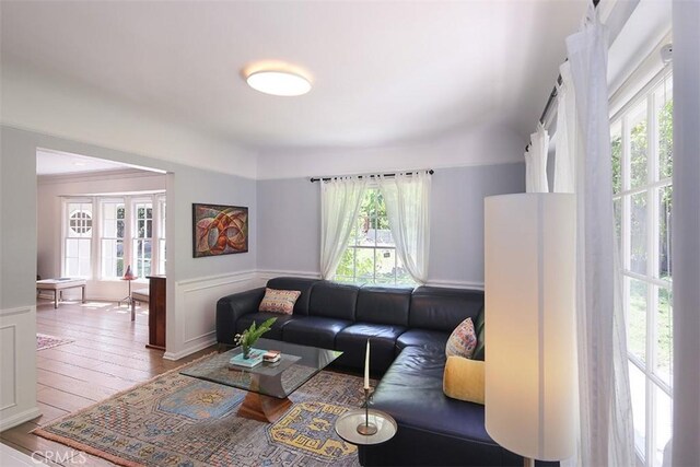 2450 Hermosita Dr, Glendale, CA 91208 - living room featuring wainscoting, hardwood / wood-style flooring, and a decorative wall