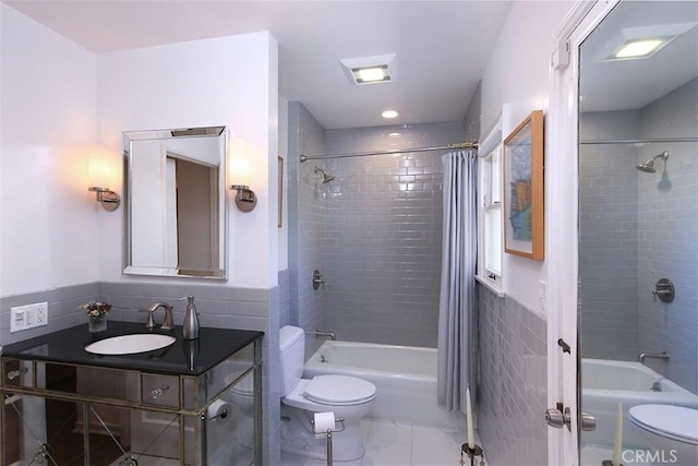 2450 Hermosita Dr, Glendale, CA 91208 - full bathroom featuring shower / tub combo, tile walls, vanity, marble look tiles, and a wainscoted wall