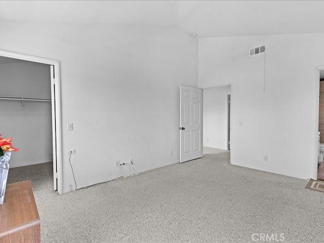 19025 Windridge Ln, Huntington Beach, CA 92646 - unfurnished bedroom featuring a walk in closet, a closet, and high vaulted ceiling