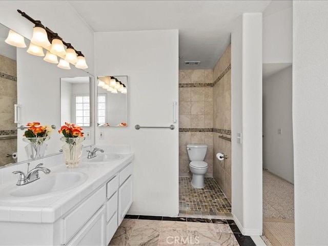 19025 Windridge Ln, Huntington Beach, CA 92646 - bathroom featuring double vanity and toilet