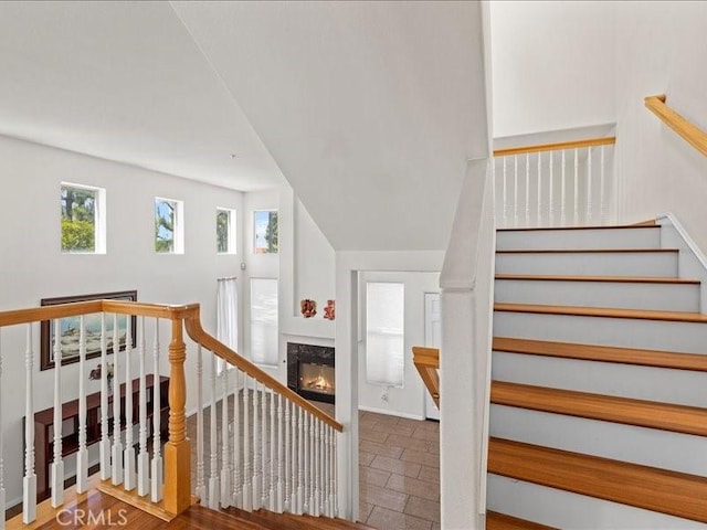 19025 Windridge Ln, Huntington Beach, CA 92646 - staircase featuring a high end fireplace