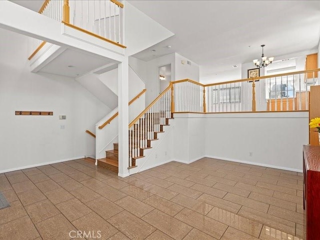 19025 Windridge Ln, Huntington Beach, CA 92646 - stairway with a chandelier and baseboards