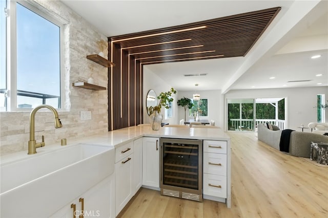13021 Killion St, Sherman Oaks, CA 91401 - bar with beverage cooler, decorative backsplash, light wood-type flooring, and recessed lighting