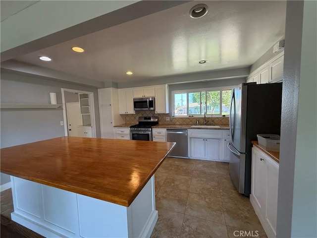 4561 Mimosa Dr, Yorba Linda, CA 92886 - kitchen featuring stainless steel appliances, white cabinets, backsplash, and recessed lighting