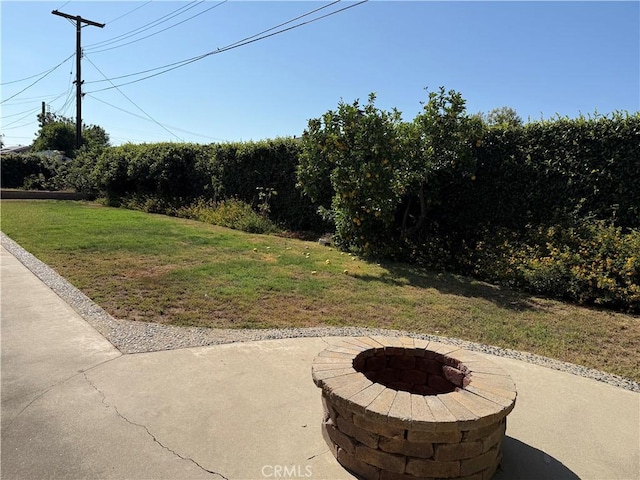 4561 Mimosa Dr, Yorba Linda, CA 92886 - view of grassy yard with a fire pit and a patio area