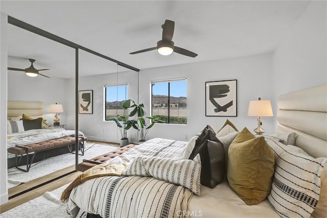 25611 Quail Run Unit 77, Dana Point, CA 92629 - bedroom with ceiling fan and wood finished floors