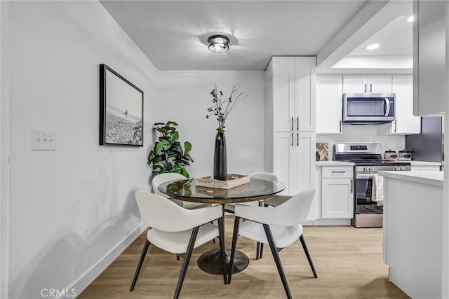 25611 Quail Run Unit 77, Dana Point, CA 92629 - dining area featuring light wood finished floors and recessed lighting