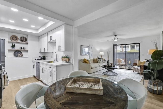 25611 Quail Run Unit 77, Dana Point, CA 92629 - living room with light wood-style floors, a ceiling fan, recessed lighting, and a raised ceiling