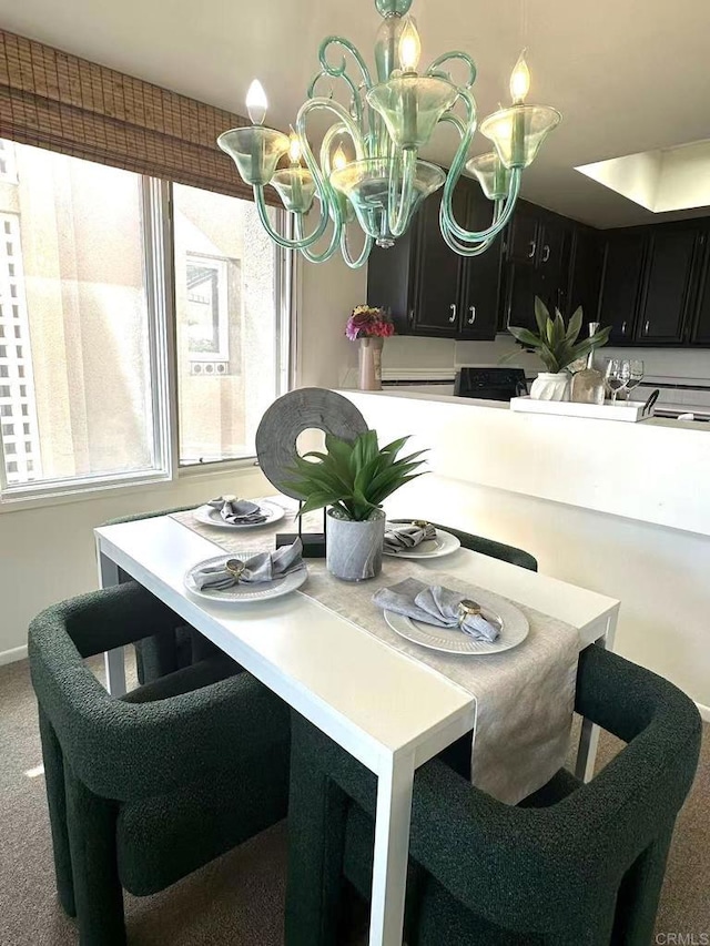 3998 Nobel Dr Unit 302, San Diego, CA 92122 - dining area featuring carpet floors, plenty of natural light, and a chandelier