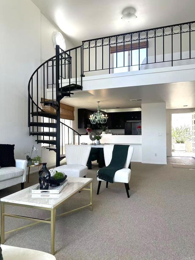 3998 Nobel Dr Unit 302, San Diego, CA 92122 - carpeted living area featuring stairway, a towering ceiling, and a chandelier