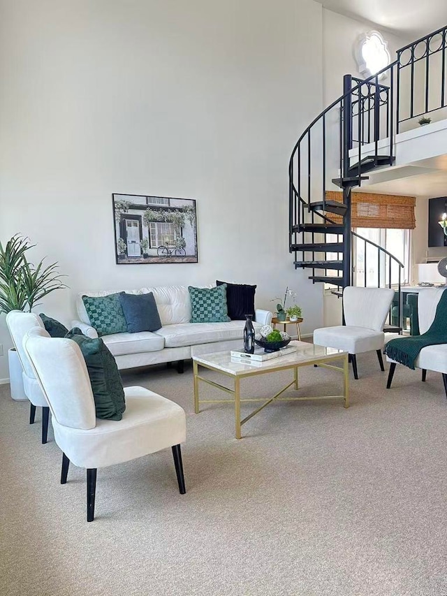 3998 Nobel Dr Unit 302, San Diego, CA 92122 - living room with a towering ceiling, carpet, and stairway
