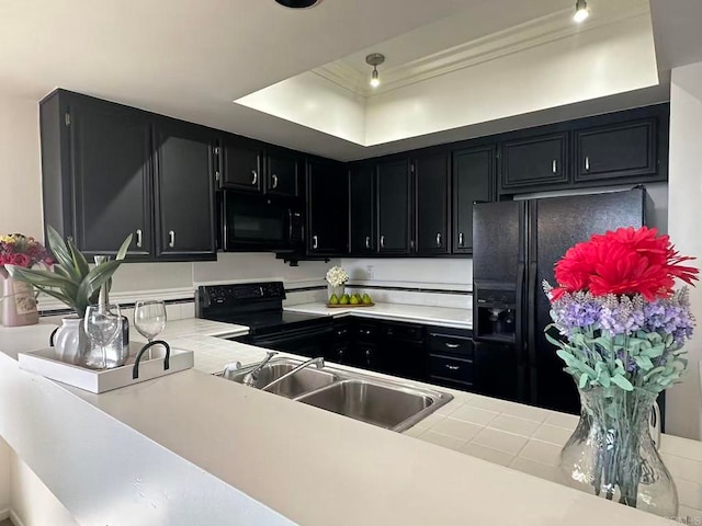 3998 Nobel Dr Unit 302, San Diego, CA 92122 - kitchen with dark cabinets, black appliances, light countertops, a raised ceiling, and crown molding