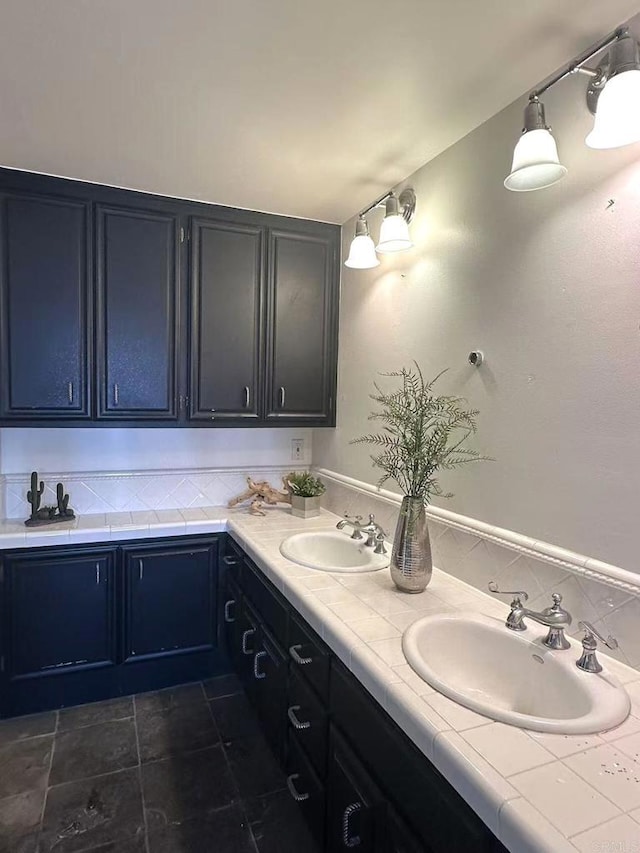 3998 Nobel Dr Unit 302, San Diego, CA 92122 - bathroom with double vanity and decorative backsplash
