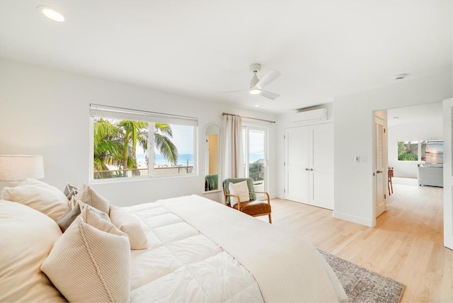 231 5th St, Encinitas, CA 92024 - bedroom with multiple windows, light wood-style floors, a wall mounted AC, recessed lighting, and a ceiling fan