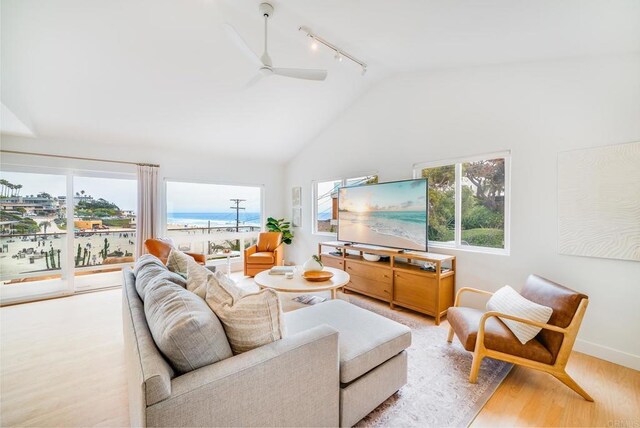 231 5th St, Encinitas, CA 92024 - living room with rail lighting, wood finished floors, ceiling fan, and high vaulted ceiling