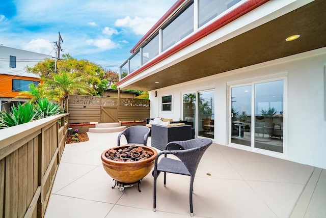 231 5th St, Encinitas, CA 92024 - view of patio with an outdoor fire pit and a gate