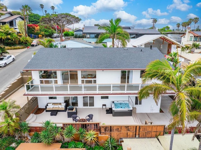 231 5th St, Encinitas, CA 92024 - back of property with an outdoor hangout area, a fenced front yard, a patio area, and roof with shingles