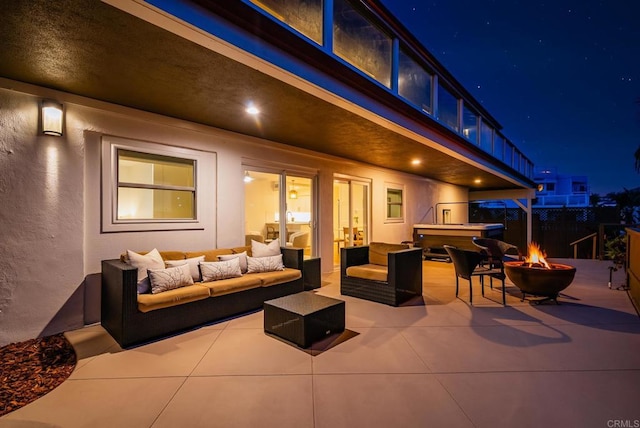 231 5th St, Encinitas, CA 92024 - patio at night featuring a patio area, an outdoor living space with a fire pit, and a hot tub