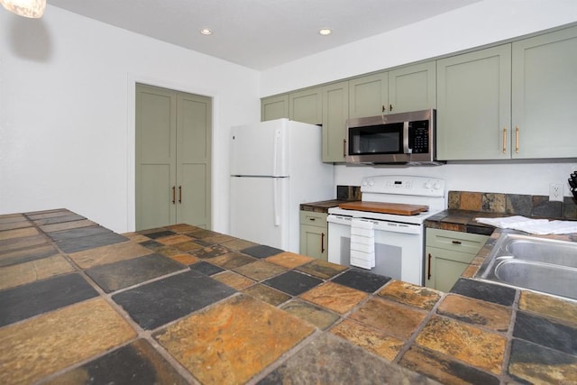 7988 Mission Center Ct Unit H, San Diego, CA 92108 - kitchen featuring white appliances, green cabinets, dark countertops, and recessed lighting