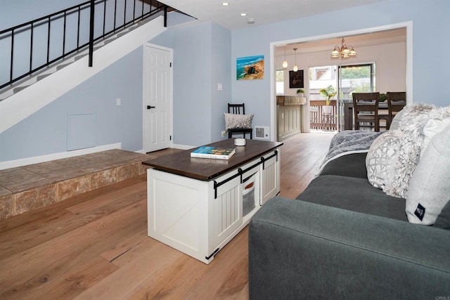 7988 Mission Center Ct Unit H, San Diego, CA 92108 - living area featuring light wood-style flooring, a chandelier, stairway, and recessed lighting