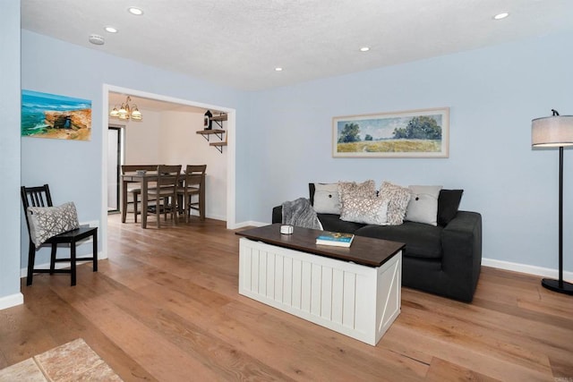 7988 Mission Center Ct Unit H, San Diego, CA 92108 - living area featuring recessed lighting, a chandelier, and light wood finished floors
