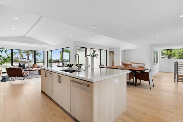 2052 Montgomery Ave, Cardiff By The Sea, CA 92007 - kitchen featuring open floor plan, modern cabinets, light brown cabinets, light wood-type flooring, and a kitchen island with sink