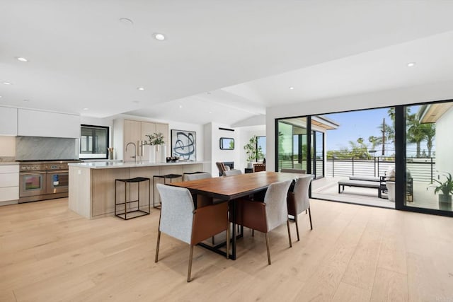 2052 Montgomery Ave, Cardiff By The Sea, CA 92007 - dining area with light wood-type flooring, healthy amount of natural light, vaulted ceiling, and recessed lighting