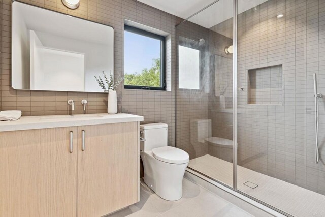2052 Montgomery Ave, Cardiff By The Sea, CA 92007 - full bath featuring tile walls, vanity, a stall shower, tile patterned flooring, and decorative backsplash